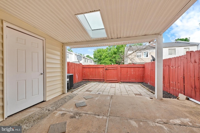 view of patio featuring a fenced backyard and central air condition unit