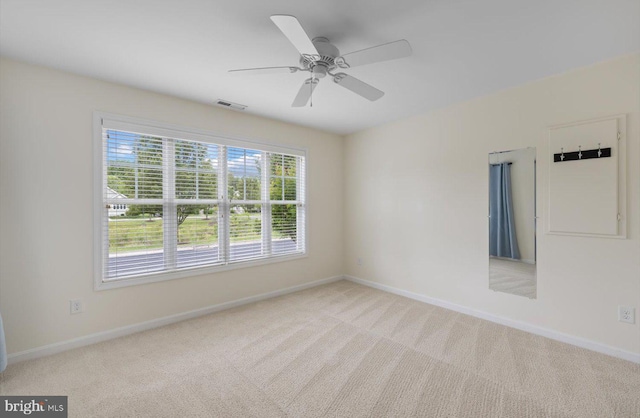 36518 Harmon Bay Blvd Unit 27, Rehoboth Beach, DE 19971 - spare room featuring carpet, baseboards, and ceiling fan