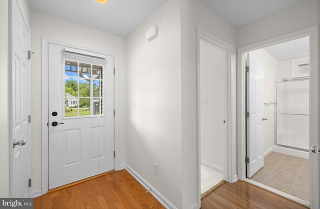 36518 Harmon Bay Blvd Unit 27, Rehoboth Beach, DE 19971 - doorway featuring wood finished floors and baseboards