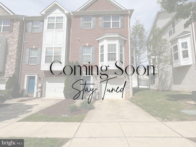 3334 Castle Ridge Cir Unit 8, Silver Spring, MD 20904 - view of front facade with a garage, brick siding, and driveway