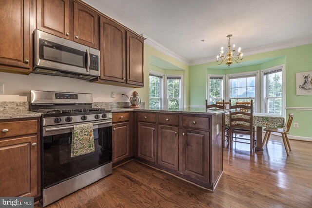 3334 Castle Ridge Cir Unit 8, Silver Spring, MD 20904 - kitchen with stainless steel appliances, a chandelier, dark wood finished floors, ornamental molding, and a peninsula