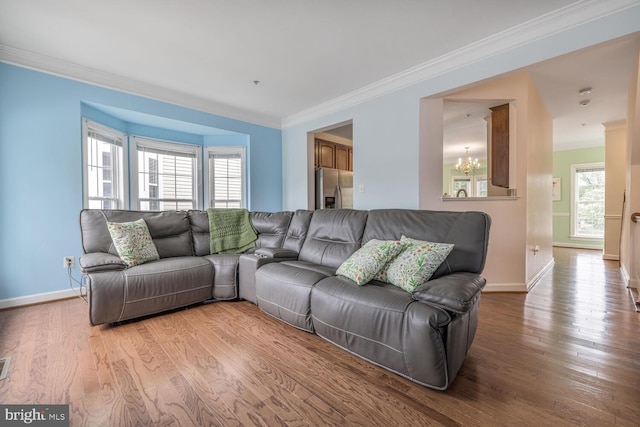 3334 Castle Ridge Cir Unit 8, Silver Spring, MD 20904 - living room featuring crown molding, a chandelier, plenty of natural light, wood finished floors, and baseboards