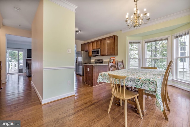 3334 Castle Ridge Cir Unit 8, Silver Spring, MD 20904 - dining area with a chandelier, baseboards, crown molding, and wood finished floors