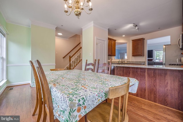 3334 Castle Ridge Cir Unit 8, Silver Spring, MD 20904 - dining area featuring a chandelier, wood finished floors, ornamental molding, stairway, and baseboards
