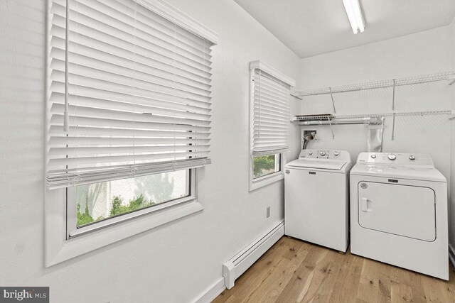 201 E Main St, Fairfield, PA 17320 - laundry room featuring a baseboard radiator, washer and clothes dryer, light wood-style floors, and baseboards