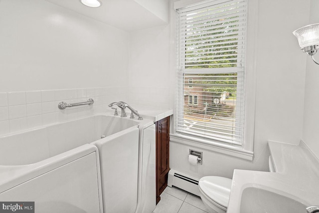 201 E Main St, Fairfield, PA 17320 - bathroom featuring a baseboard radiator, a bath, plenty of natural light, and tile patterned flooring