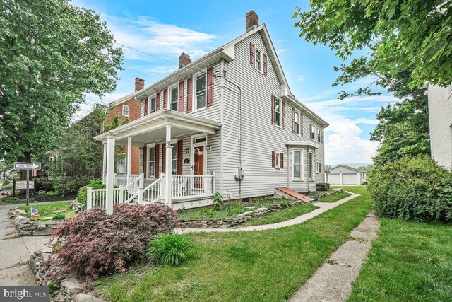 201 E Main St, Fairfield, PA 17320 - view of front of property featuring a chimney, covered porch, a front lawn, and crawl space