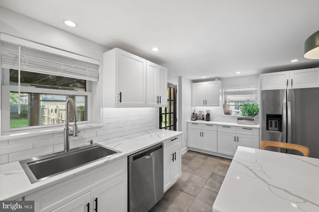 1505 Wynnewood Rd, Ardmore, PA 19003 - kitchen featuring stainless steel appliances, backsplash, white cabinets, recessed lighting, and light stone counters