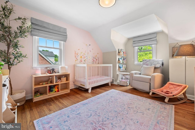 1505 Wynnewood Rd, Ardmore, PA 19003 - bedroom featuring wood finished floors, a crib, and lofted ceiling