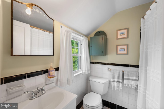 1505 Wynnewood Rd, Ardmore, PA 19003 - bathroom featuring tile walls, vaulted ceiling, wainscoting, and vanity