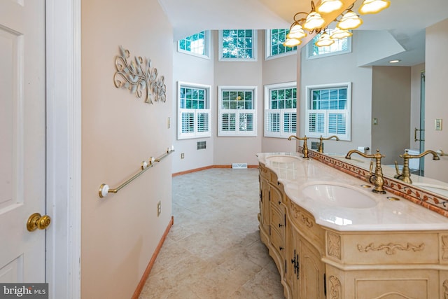 6 Benedek Rd, Princeton, NJ 08540 - full bathroom with double vanity, a chandelier, tile patterned flooring, and a towering ceiling