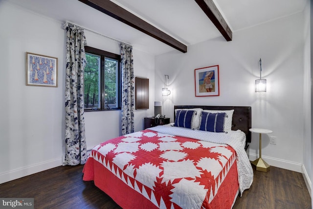 bedroom featuring baseboards, beam ceiling, and wood finished floors