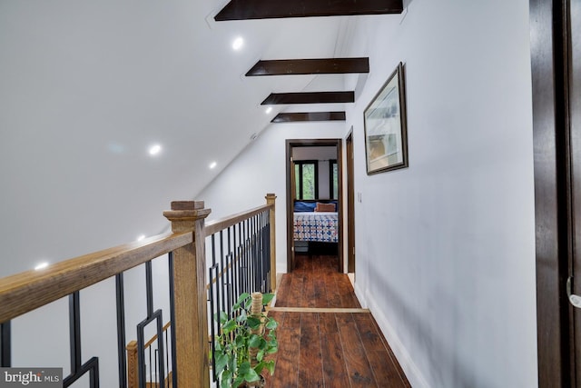 corridor featuring wood finished floors, vaulted ceiling, recessed lighting, and baseboards