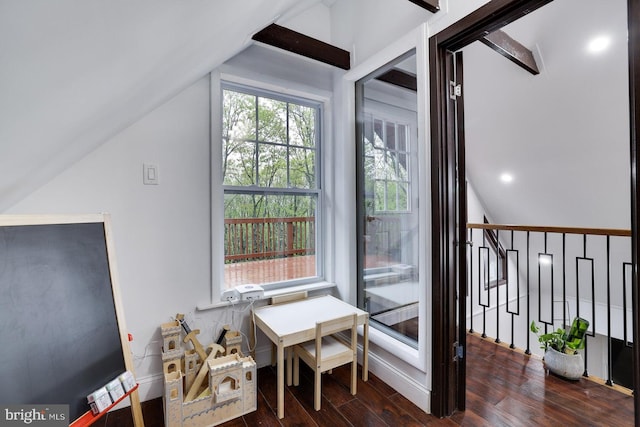 additional living space featuring lofted ceiling and wood finished floors