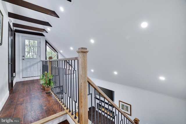 stairway with recessed lighting and wood finished floors