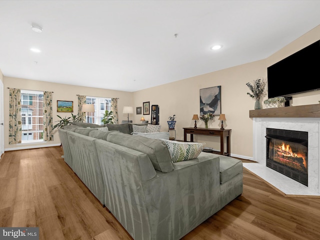 1413 Peregrine Path, Arnold, MD 21012 - living room with a fireplace with flush hearth, wood finished floors, recessed lighting, and baseboards