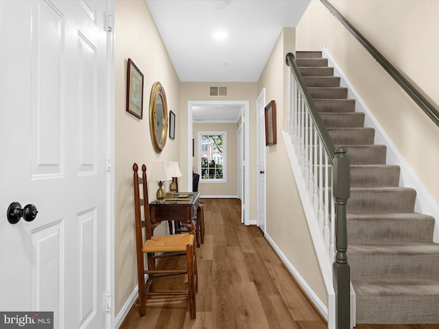 1413 Peregrine Path, Arnold, MD 21012 - hallway featuring wood finished floors, stairs, and baseboards