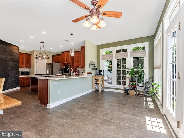 106 Bedrock Dr, Walkersville, MD 21793 - kitchen with light countertops, healthy amount of natural light, a ceiling fan, decorative backsplash, and recessed lighting