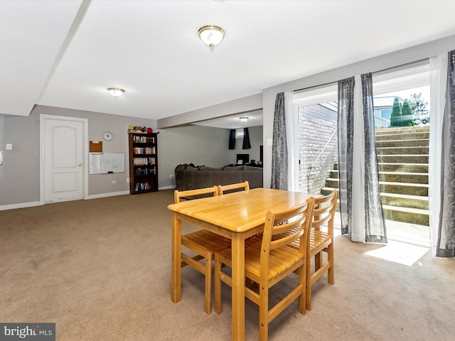 106 Bedrock Dr, Walkersville, MD 21793 - dining room featuring light carpet, baseboards, and stairs