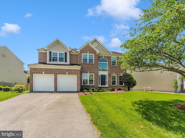 106 Bedrock Dr, Walkersville, MD 21793 - view of front of house featuring asphalt driveway, a front lawn, a garage, and brick siding