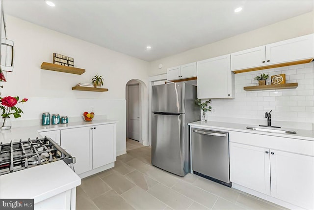 564 9th Ave, Prospect Park, PA 19076 - kitchen featuring open shelves, appliances with stainless steel finishes, white cabinets, light countertops, and recessed lighting