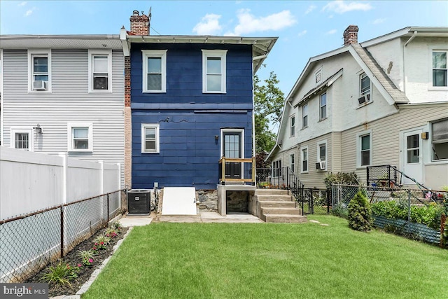 564 9th Ave, Prospect Park, PA 19076 - back of house with a chimney, a fenced backyard, and cooling unit