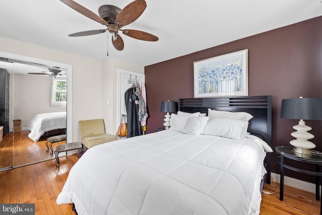806 S Beechfield Ave, Baltimore, MD 21229 - bedroom with wood-type flooring, a ceiling fan, and baseboards