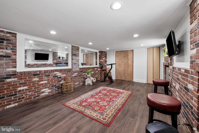 806 S Beechfield Ave, Baltimore, MD 21229 - living room featuring brick wall, wood finished floors, and recessed lighting