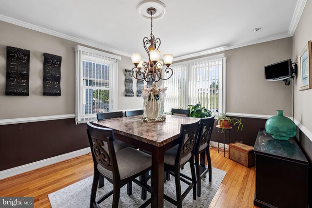 806 S Beechfield Ave, Baltimore, MD 21229 - dining area featuring a chandelier, hardwood / wood-style floors, ornamental molding, and baseboards
