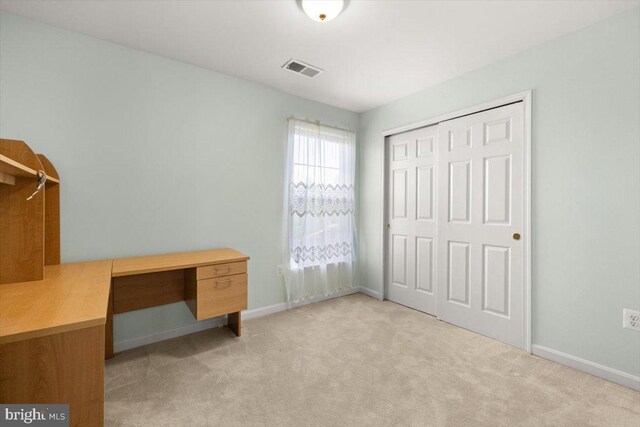 313 Indianhead Ct, Woodstock, VA 22664 - unfurnished bedroom with light carpet, baseboards, a closet, and an office area