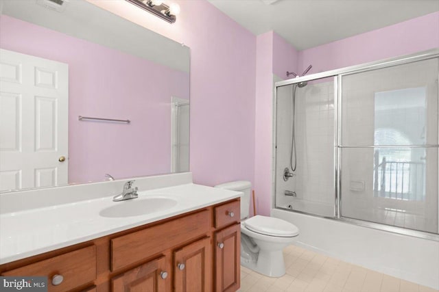 313 Indianhead Ct, Woodstock, VA 22664 - full bathroom with toilet, tile patterned floors, vanity, and combined bath / shower with glass door