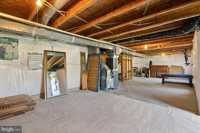 313 Indianhead Ct, Woodstock, VA 22664 - unfinished below grade area with heating unit and carpet flooring