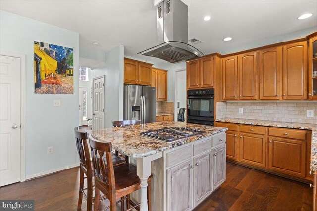 313 Indianhead Ct, Woodstock, VA 22664 - kitchen with appliances with stainless steel finishes, island range hood, a kitchen breakfast bar, dark wood-style floors, and recessed lighting