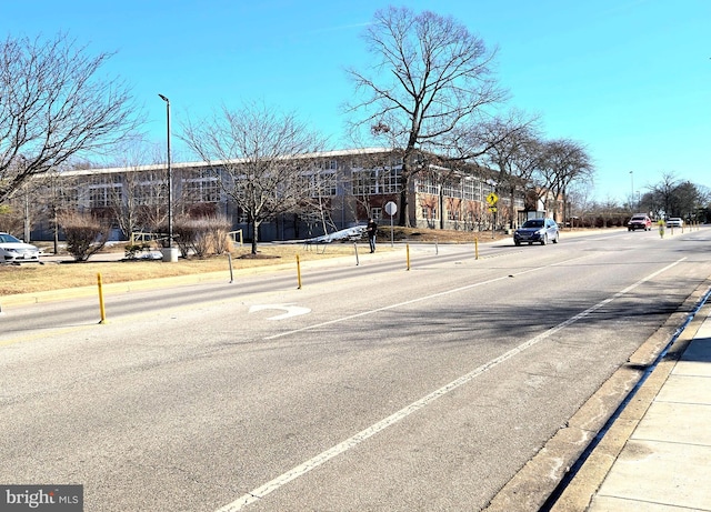 290 Hilltop Ln, Annapolis, MD 21403 - view of asphalt road featuring curbs, traffic signs, and sidewalks