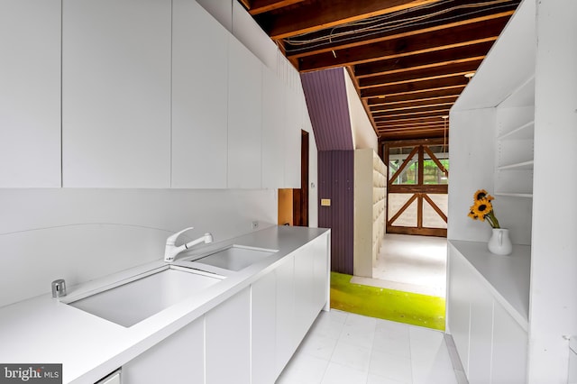 laundry room featuring a sink and light flooring