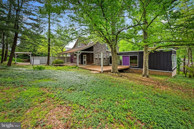 view of yard featuring a wooden deck