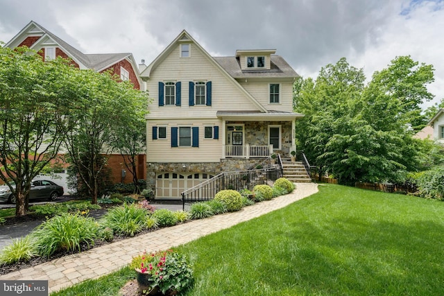 5526 Macarthur Blvd NW, Washington, DC 20016 - view of front of property featuring stone siding, stairs, covered porch, a front yard, and an attached garage