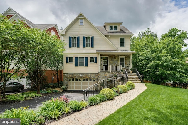 5526 Macarthur Blvd NW, Washington, DC 20016 - craftsman-style home with stone siding, stairway, asphalt driveway, and covered porch