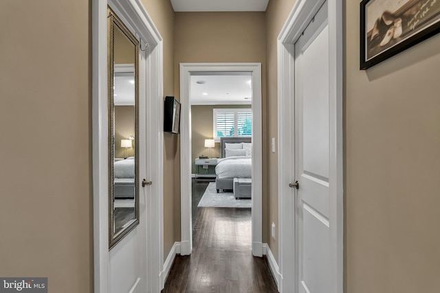 5526 Macarthur Blvd NW, Washington, DC 20016 - corridor featuring dark wood-style flooring and baseboards