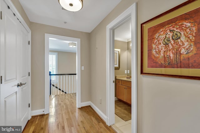 5526 Macarthur Blvd NW, Washington, DC 20016 - corridor featuring an upstairs landing, light wood-style flooring, and baseboards