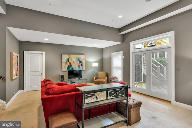 5526 Macarthur Blvd NW, Washington, DC 20016 - living area featuring light colored carpet, baseboards, french doors, and recessed lighting