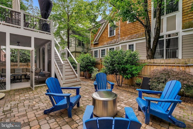 5526 Macarthur Blvd NW, Washington, DC 20016 - view of patio featuring stairs, an outdoor living space with a fire pit, a balcony, and a ceiling fan