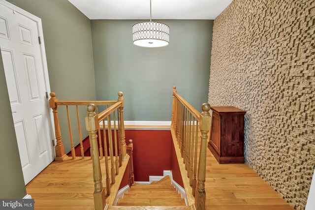 5526 Macarthur Blvd NW, Washington, DC 20016 - staircase featuring wood finished floors