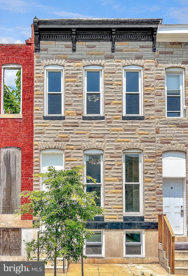 view of front of property featuring stone siding