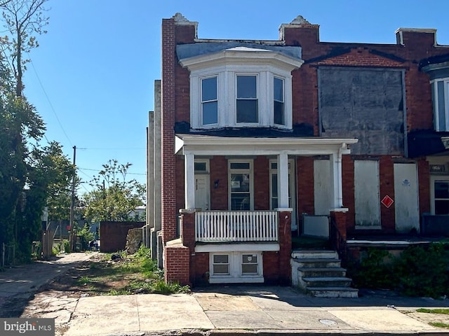 multi unit property featuring a porch