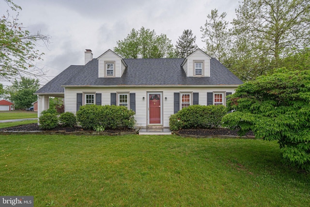 cape cod-style house with a chimney, a front lawn, and a shingled roof