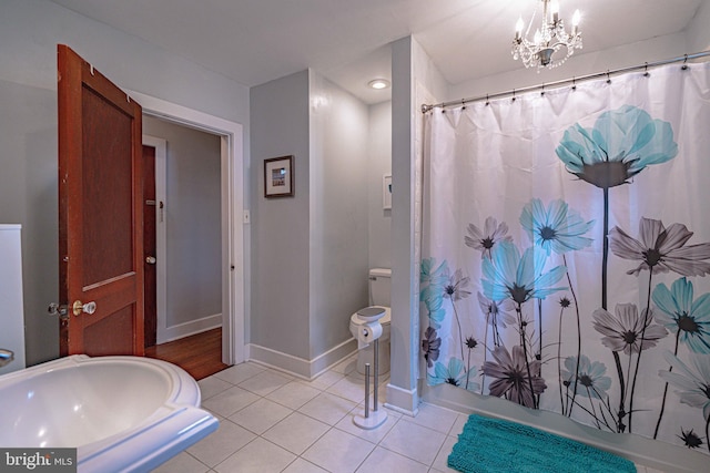 bathroom featuring tile patterned floors, baseboards, a chandelier, shower / bath combo with shower curtain, and recessed lighting