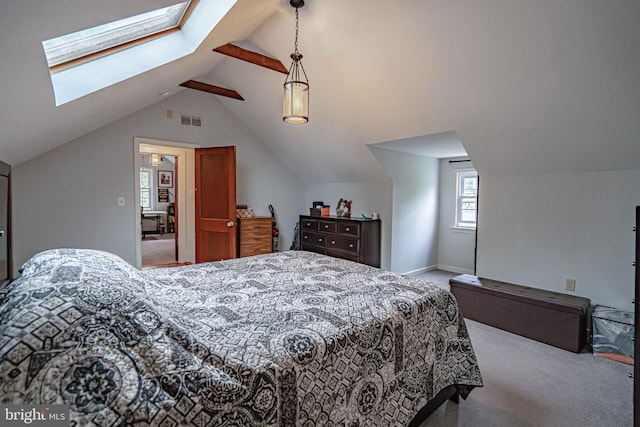 carpeted bedroom featuring a skylight, lofted ceiling, and baseboards