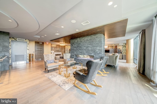 45 Sutton Sq SW Unit Ph11, Washington, DC 20024 - living area featuring hardwood / wood-style floors and a stone fireplace