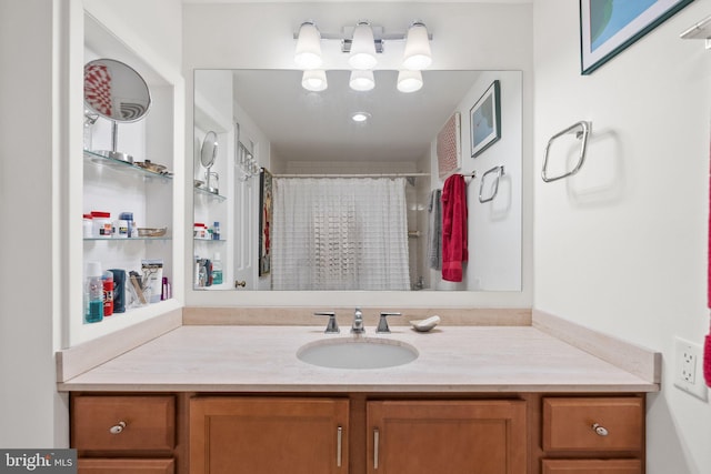 bathroom with vanity and curtained shower